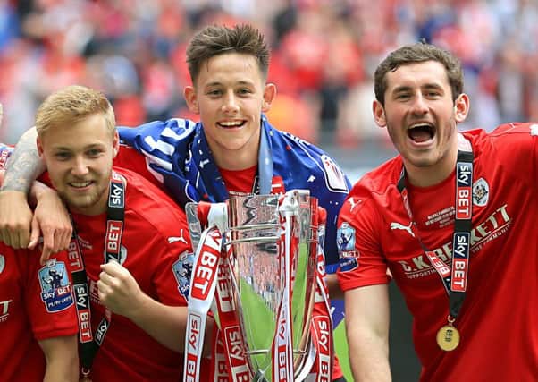 Josh Brownhill (centre) with the League One play-off final trophy on Sunday