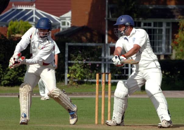 Eccleston wicket keeper David Hewson takes the ball wtched by Mawdesley batsman Dave Whiteley