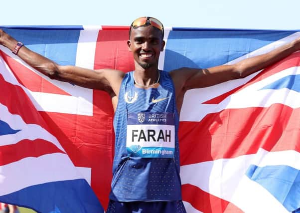 Mo Farah celebrates after setting a new British record in the men's 3000m during the IAAF Diamond League in  Birmingham.