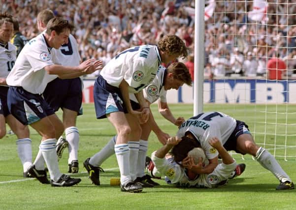 The players recreate the infamous drinking game to celebrate Gazza's goal