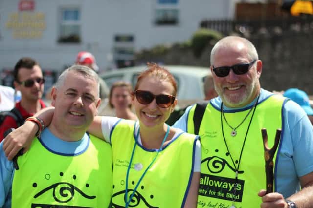 Kevin Lonergan with event organiser Emma Russ and volunteer at the Galloway's Society for the Blind's Morecambe Bay Walk