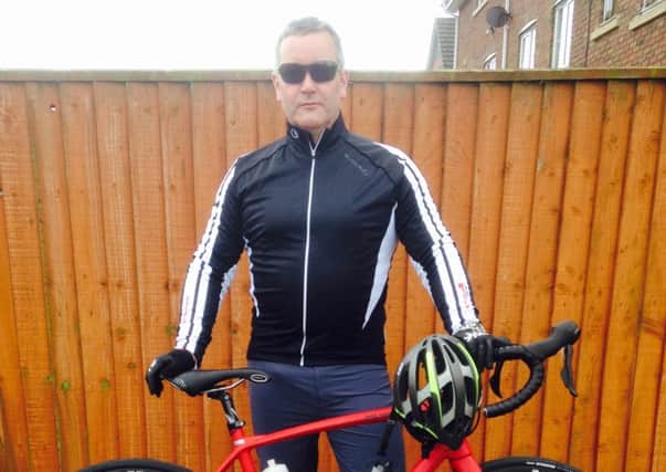 Paul Lloyd taking part in the Caen to Alps DHuez Ride 1000 for St Catherine's Hospice