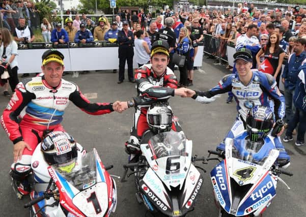 John McGuinness celebrates coming third in the Senior TT with Michael Dunlop, centre, and Ian Hutchinson, right. Picture: Stephen Davison - Pacemaker Press.