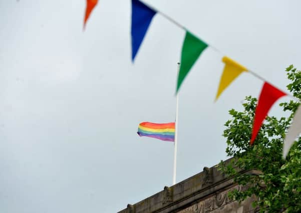 Photo Neil Cross
The rainbow flag is flown at half mast on the top of Preston Town Hall to mark the shootings in Orlando