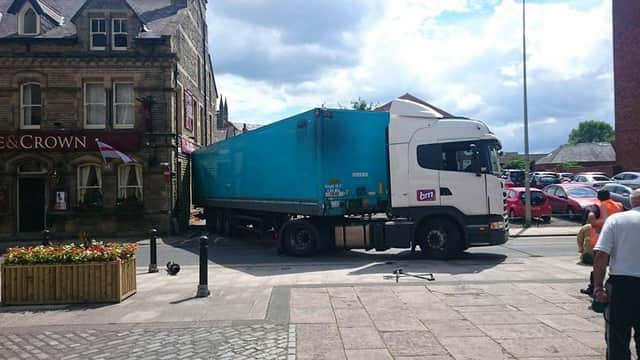 Firefighters were called to cut a lorry free after it became stuck between bollards in Chorley town centre. CREDIT: Martyn Elkins