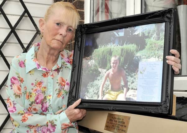 Ann Croston of Platt Bridge with a picture of her son, Craig
