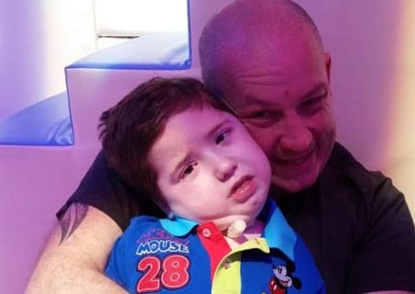 Rick Bolton, from Chorley, and his son Isaac, who suffers with cerebal palsy