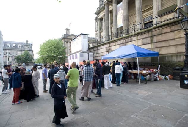 Scenes from a previous Feed The Homeless event - the Muslim community who broke their fast to share food with the homeless on the Flag Market in Preston