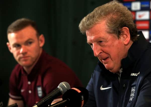 Roy Hodgson has shown a positive approach in including five attackers, including skipper Wayne Rooney (left)