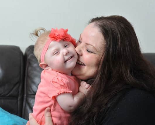 Photo Neil Cross
Sara Gardner's daughter 18-month old Clara Walsh has a rare genetic disorder and is terminally ill. Her parents are trying to raise money to get her to a doctor in America who can help.