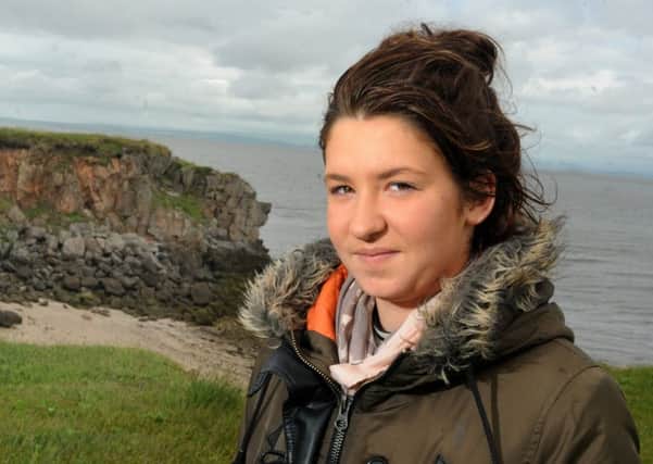 Very lucky: Megan Walton returns to where she fell 15ft from the cliff.