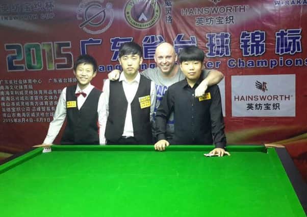 Snooker coach Roger Leighton with some of his students in China