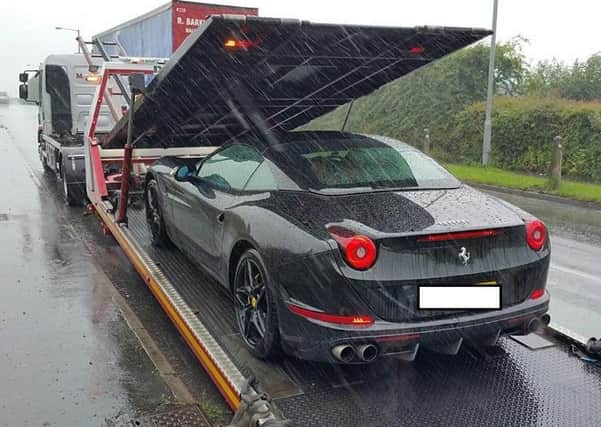 This Ferrari California convertible was seized by the police for no insurance.