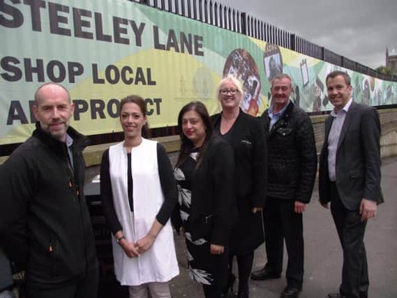 Artwork marks start of gateway improvements for Chorley Council project. Councillor Alistair Bradley is pictured right, with, from the left, Andy Nash from Newground, Councillors Zara Khan and Hasina Khan, Joanne Copeland from Pilkington Oils and Councillor Terry Brown.