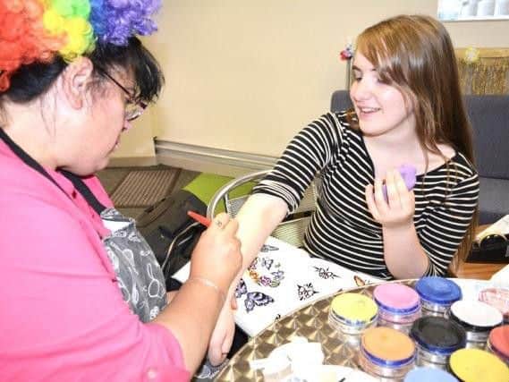 Tracy Baron, young people's worker, and Rose Parsons enjoy creating body art.