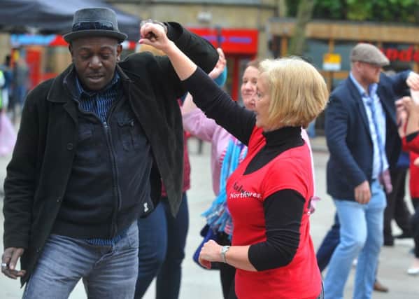 LEP  19-03-16 Members of the community try out salsa dancing at the third annual Preston Standing Together Against Racism community day, held at Preston Flag Market earlier this year .