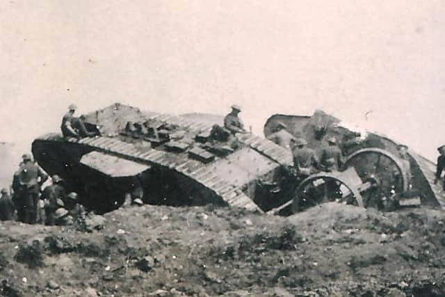 Soldiers from 1st and 4th  Battalion, South Lancashire Regiment, digging out two of the first tanks on September 15, 1916