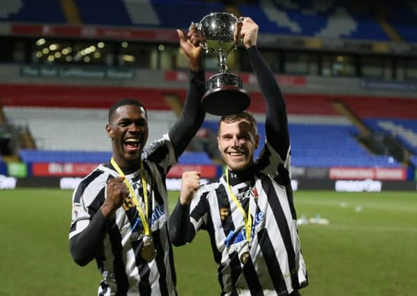 Chorley's Jake Cottrell and Darren Stephenson celebrate with the LFA Challenge Trophy