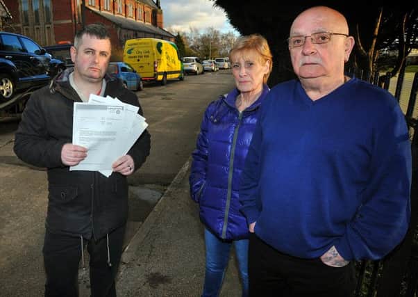 Residents on Church Ave in Preston feel their road is turning into a garage forecourt with the amount of cars and vans left parked on it. Residents Christine and Billy Worswick with their local councillor Martyn Rawlinson holding some of the correspondence written about the problem.  PIC BY ROB LOCK 24-3-2015