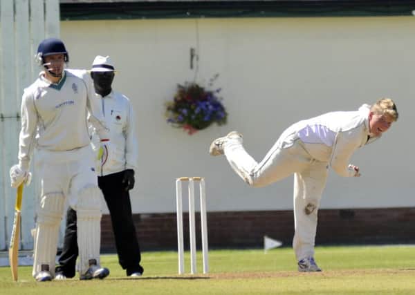 Longridge's Tom Howarth bowls in his side's victory over Leyland at Fox Lane