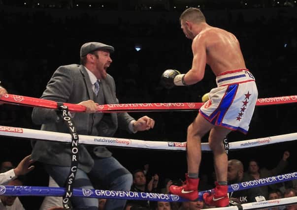 Isaac Lowe celebrates winning the English title with Tyson Fury. Picture: Lawrence Lustig
