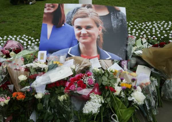 Floral tributes left in Parliament Square, London, after Labour MP Jo Cox was shot and stabbed to death