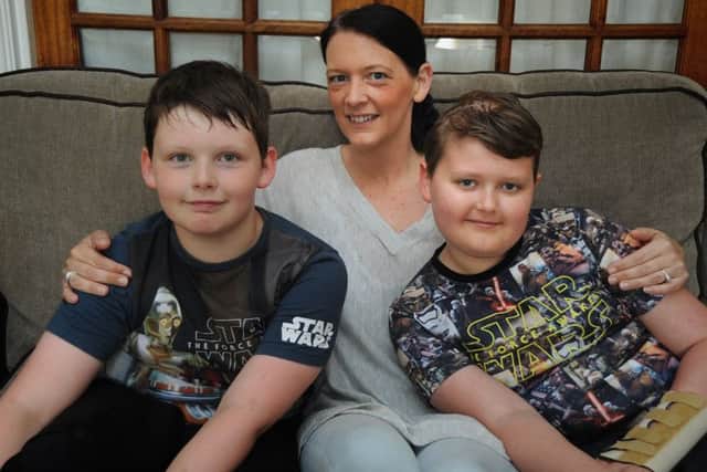 10 year-old Reece Holt, of Church Park in Overton, who was diagnosed with a brain tumour after collapsing.
Reece (right) with younger brother Callum and mum Rachel O'Neil. PIC BY ROB LOCK
6-7-2016