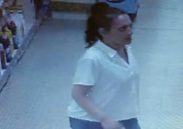 Police have released CCTV images of a woman they would like to speak to after a man was defrauded out of Â£300 in Preston.