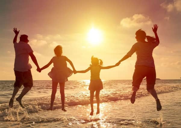 A Generic Photo of a family jumping on the beach on holiday. See PA Feature FAMILY Holidays. Picture credit should read: PA Photo/thinkstockphotos. WARNING: This picture must only be used to accompany PA Feature FAMILY Holidays.