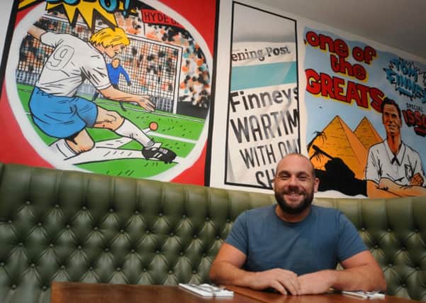 LEP  08-07-16
Co-owner Franco Sotgiu next to the painted murals, celebrating PNE success and Sir Tom Finney on the walls of the new burger restaurant Solita, Winckley Square, Preston, which is due to open next week.
