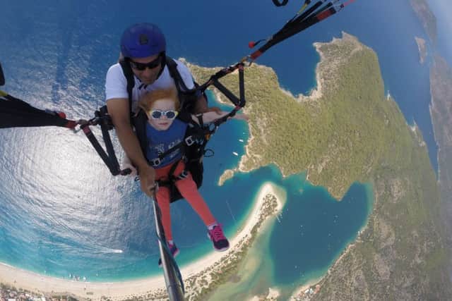 Holly Redman, five, paragliding
Holly, who has a rare condition, became the youngest person to paraglide from a mountain in Turkey