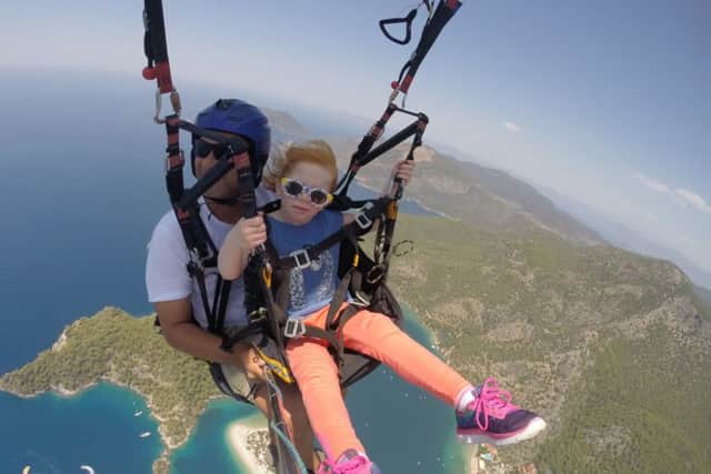 Holly Redman, five, paragliding
Holly, who has a rare condition, became the youngest person to paraglide from a mountain in Turkey