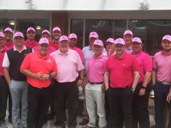 Pink attired golfers gather at Shaw Hill. Eric is second from the left on the front row in the pale pink t-shirt