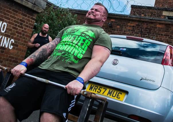 Greg Dunnings shows how to deadlift a car