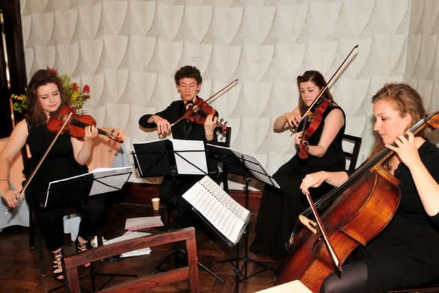 The Northern String Quartet play for visitors to afternoon tea in the tea room at Hoghton Tower