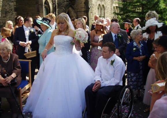 Andrew Hartley, 37, who was in a car accident when he was 17 which left him paralysed.
Doctors told Andrew his chances of having children naturally were very slim - but he is now a proud dad-of-two.
Andrew and Libby on their wedding day