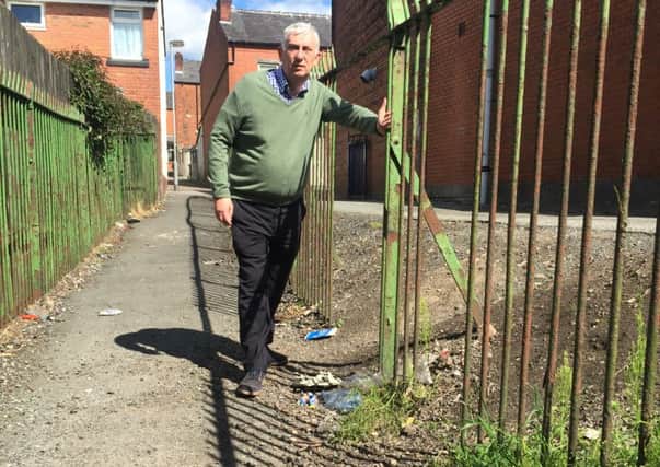 Chorley MP Lindsay Hoyle at the ginnel between Delamere Place and Progress St. There is a continual problem with railing broken, litter, dog dirt and overgrown weeds.