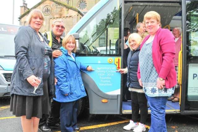 David Cocker (second left), son of Tommy Cocker, with his family celebrate the dedication to his dad on the Community Transport vehicle he will drive