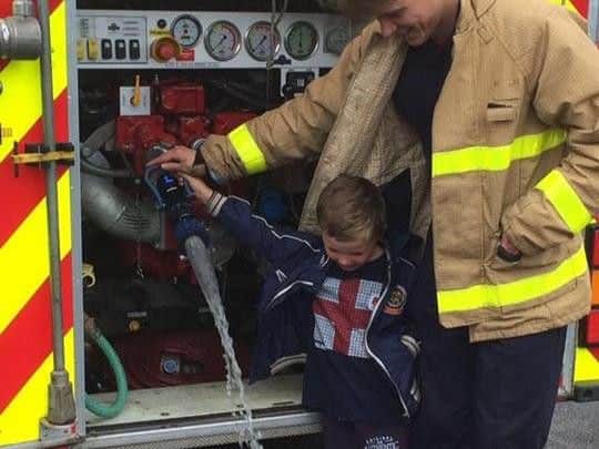 Lancashire Fire and Rescue speak to children at the fun day