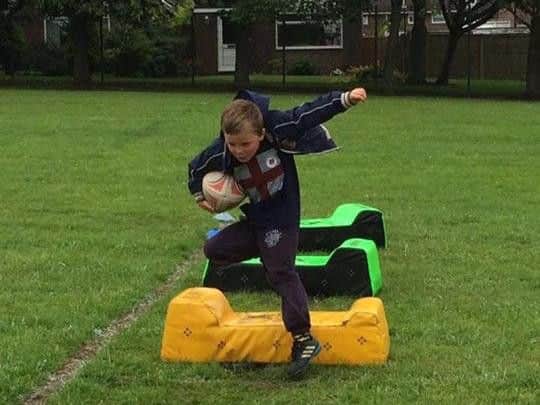 Children do rugby coaching with Grasshoppers