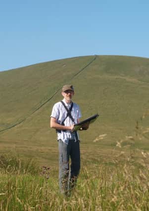Rigby Jerram plotting field  boundaries for the Pendle Hill Landscape Partnership Scheme. (Photo by M.Wright)