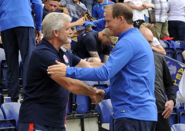 Simon Grayson (right) shakes hands with Stoke manager Mark Hughes