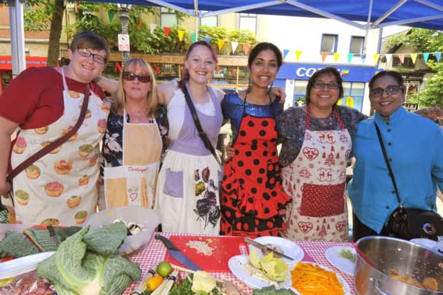 Photo Neil Cross Feast for Peace, a community food festiva on the Flag Market, Preston The Malaysian chefs
