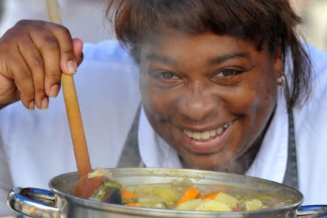 Photo Neil Cross Feast for Peace, a community food festival on the Flag Market, Preston Denise Milnes cooking hot pot