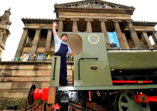 Photo Neil Cross
A steam locomotive from Ribble Steam Railway, based on the heart of Preston's docks, on Preston's Flag Market
Engine driver Stuart Gibbs