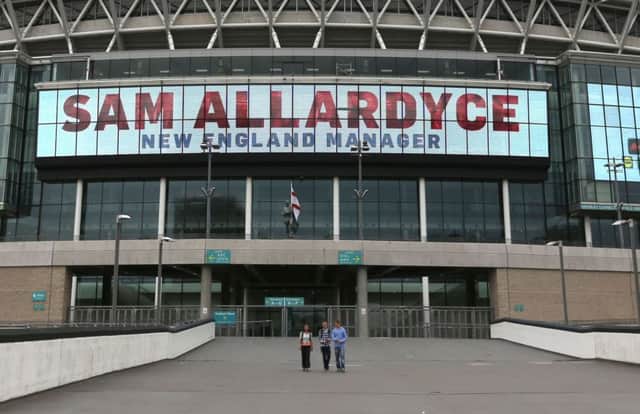 A large digital display reads "Sam Allardyce New England Manager" at Wembley Stadium