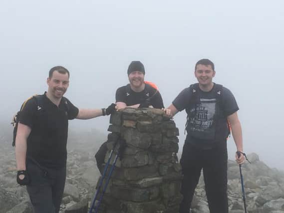 Left to right James Holland, Ryan Hamilton and Matthew Bamber at the top of Scafell Pike