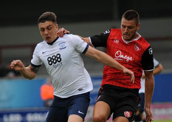Jordan Hugill battles for possession at Morecambe