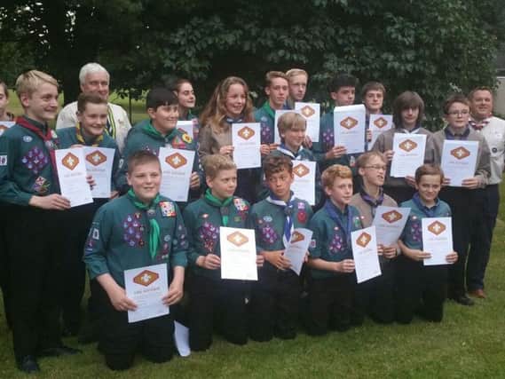 Scouts received the Chief Scouts Gold Awards certificates, presented by Andrew Corrie, the North West Regional Commissioner (second from left back row)