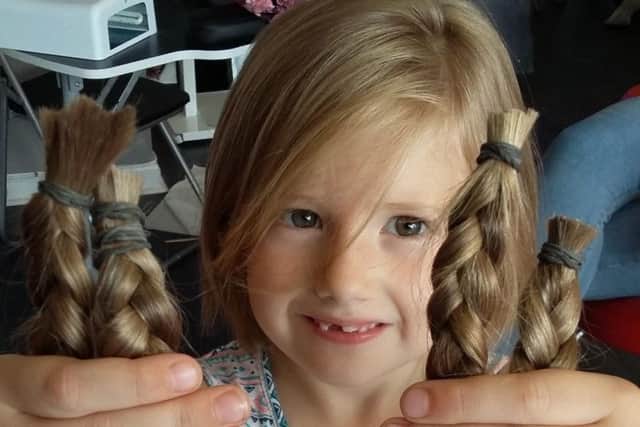 Eyvi Gillard shows off the hair she had cut for Little Princess Trust